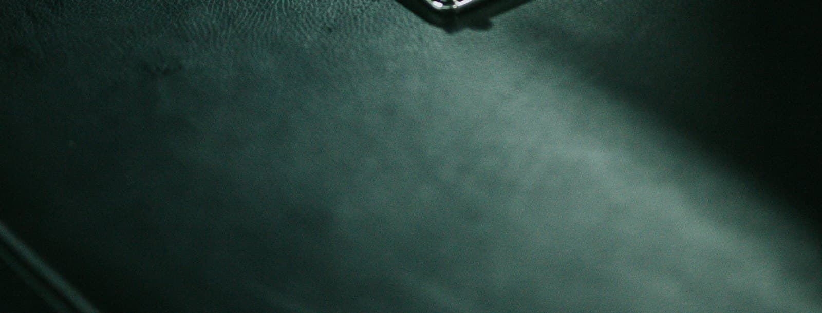 Close view of a belt buckle mechanism in black and steel